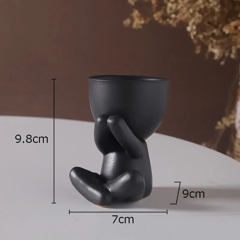Petit Bonhomme en Pot de Fleur Assis